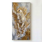 A vertical canvas painting of a white winged horse with gold accents, mounted on a plain white wall.